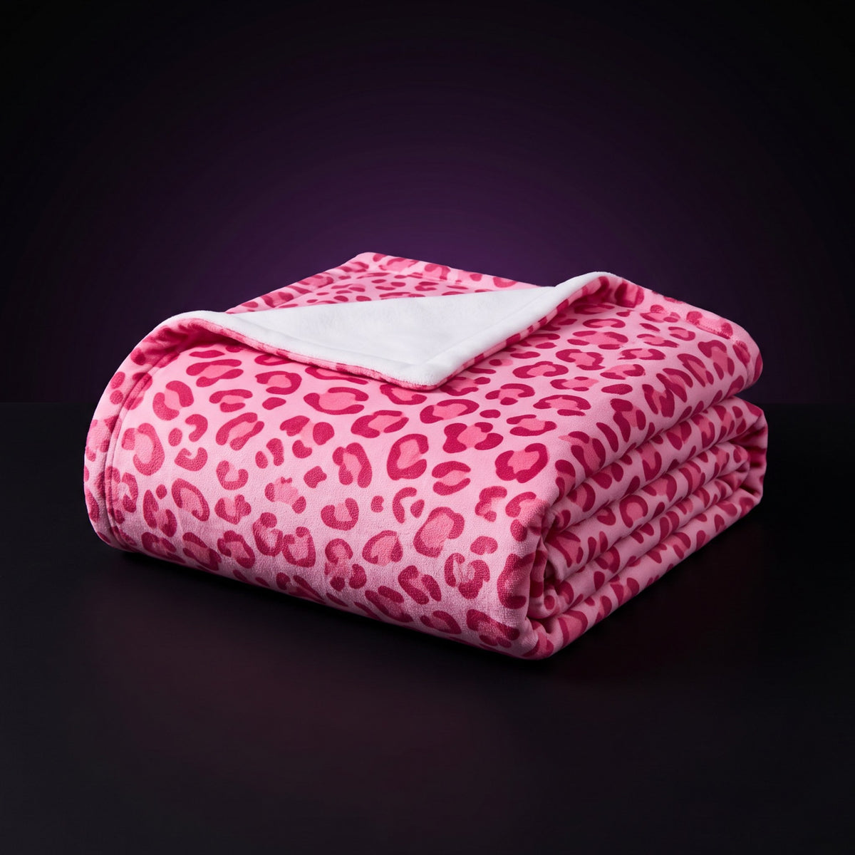 Y2K Pink Leopard Print Blanket – studio product shot on dark background with purple glow