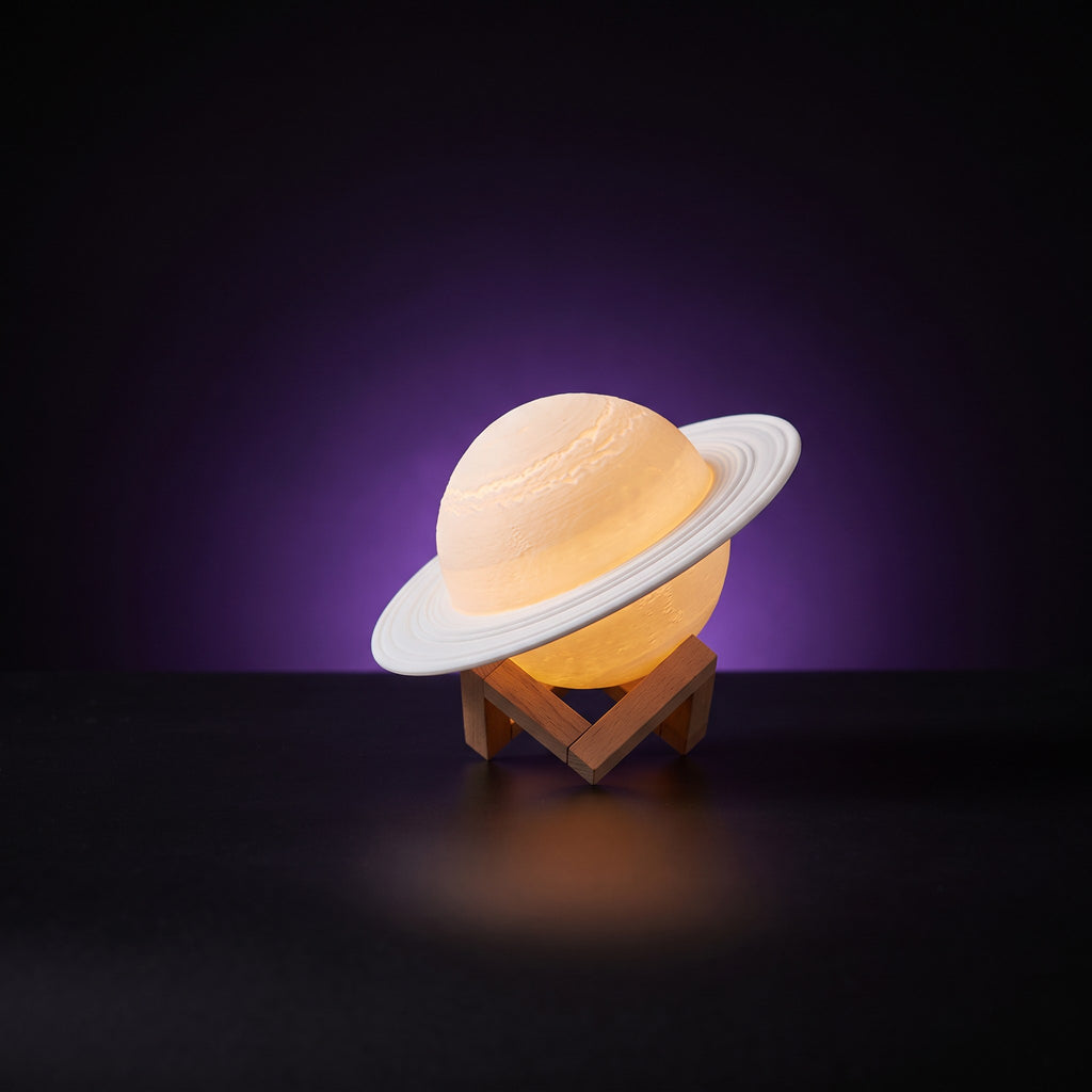 Y2K Saturn Lamp – studio product shot on dark background with purple glow