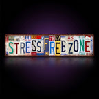 Y2K Stress Free Zone Sign – studio product shot on dark background with purple glow