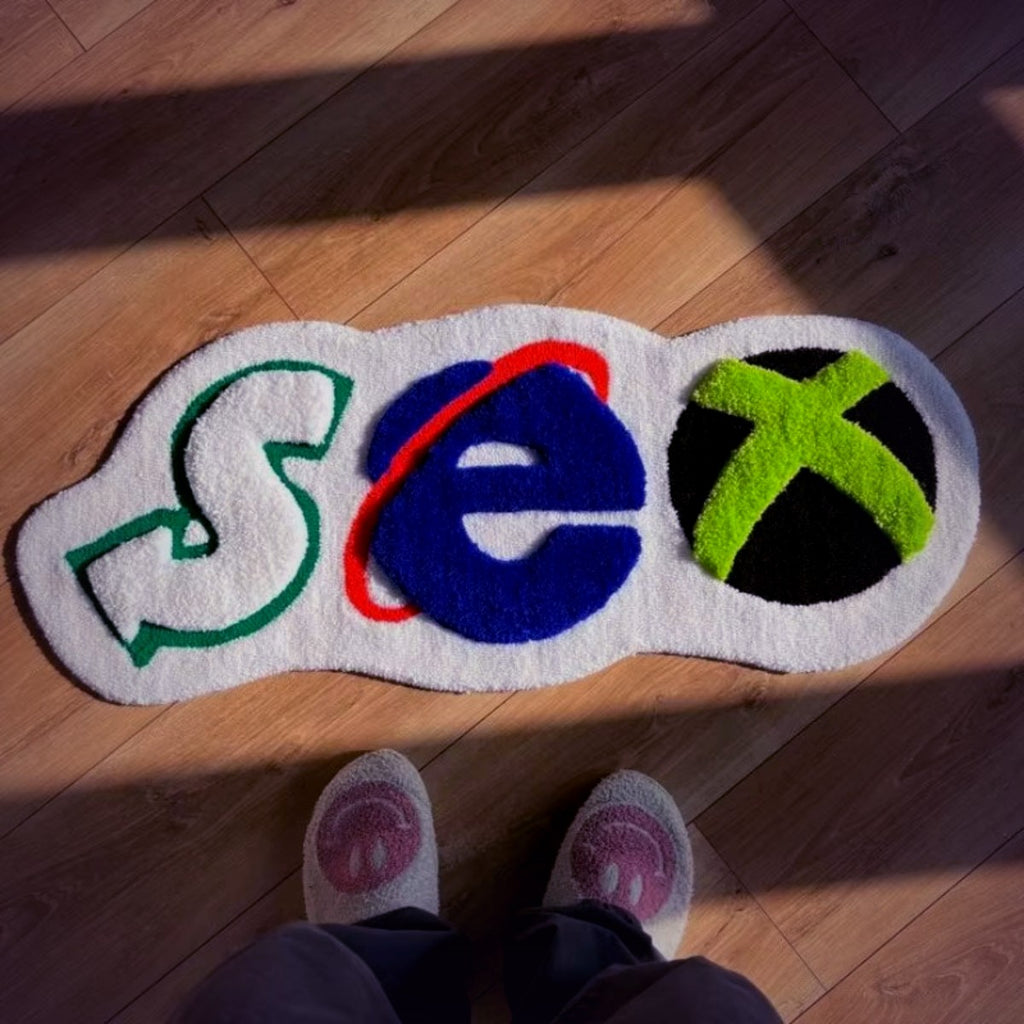 Y2K X Bath Mat on a bathroom floor